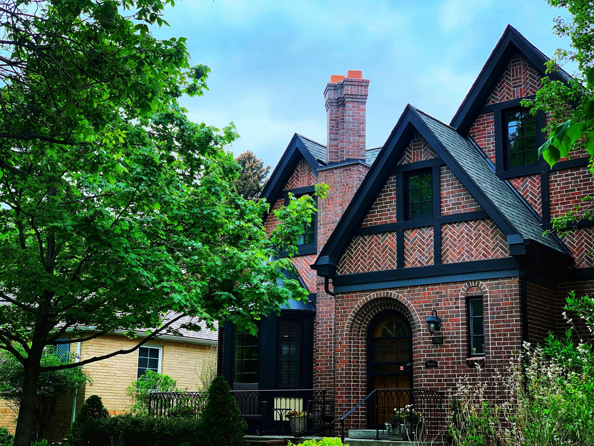 Brick Tudor-style family home on a leafy Denver street