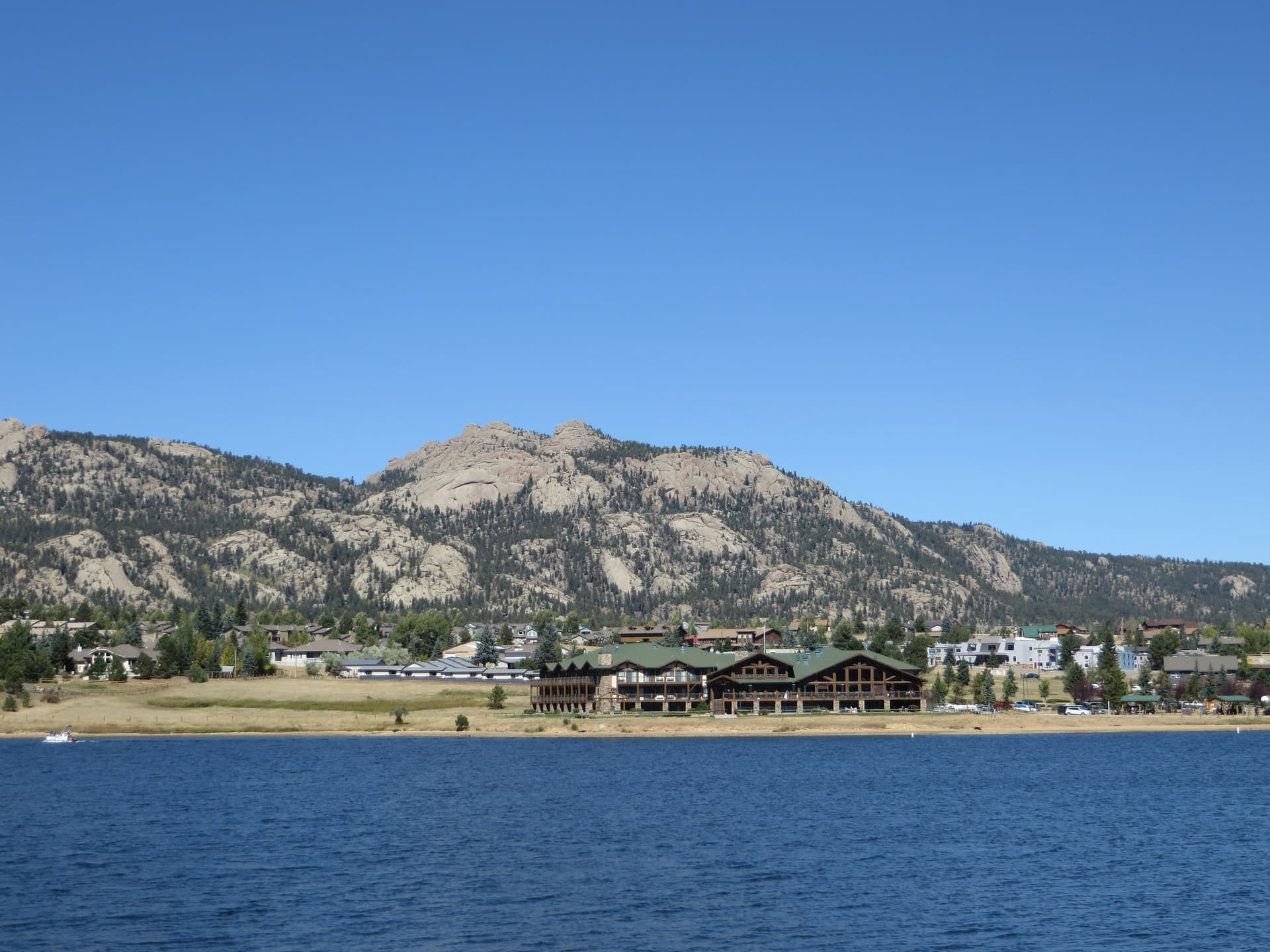Lake Estes and the Estes Park shoreline below granite foothills