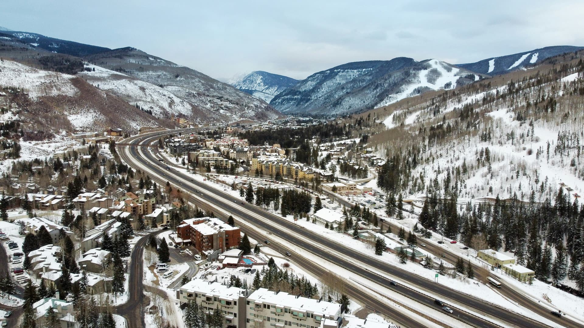 Aerial view of Vail and I-70 winding through the snowy Vail Valley