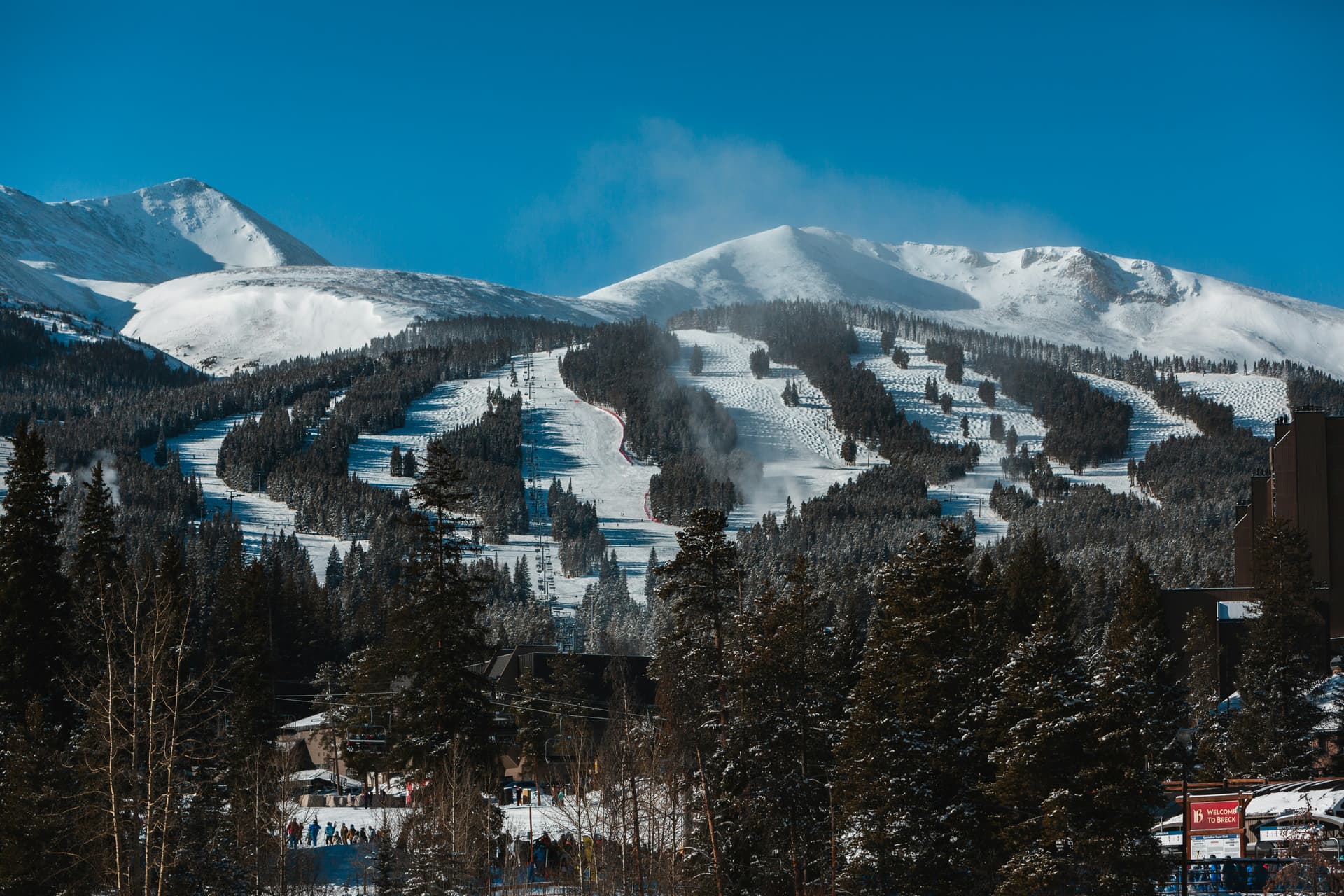 Breckenridge ski runs cut through the pines under fresh snow