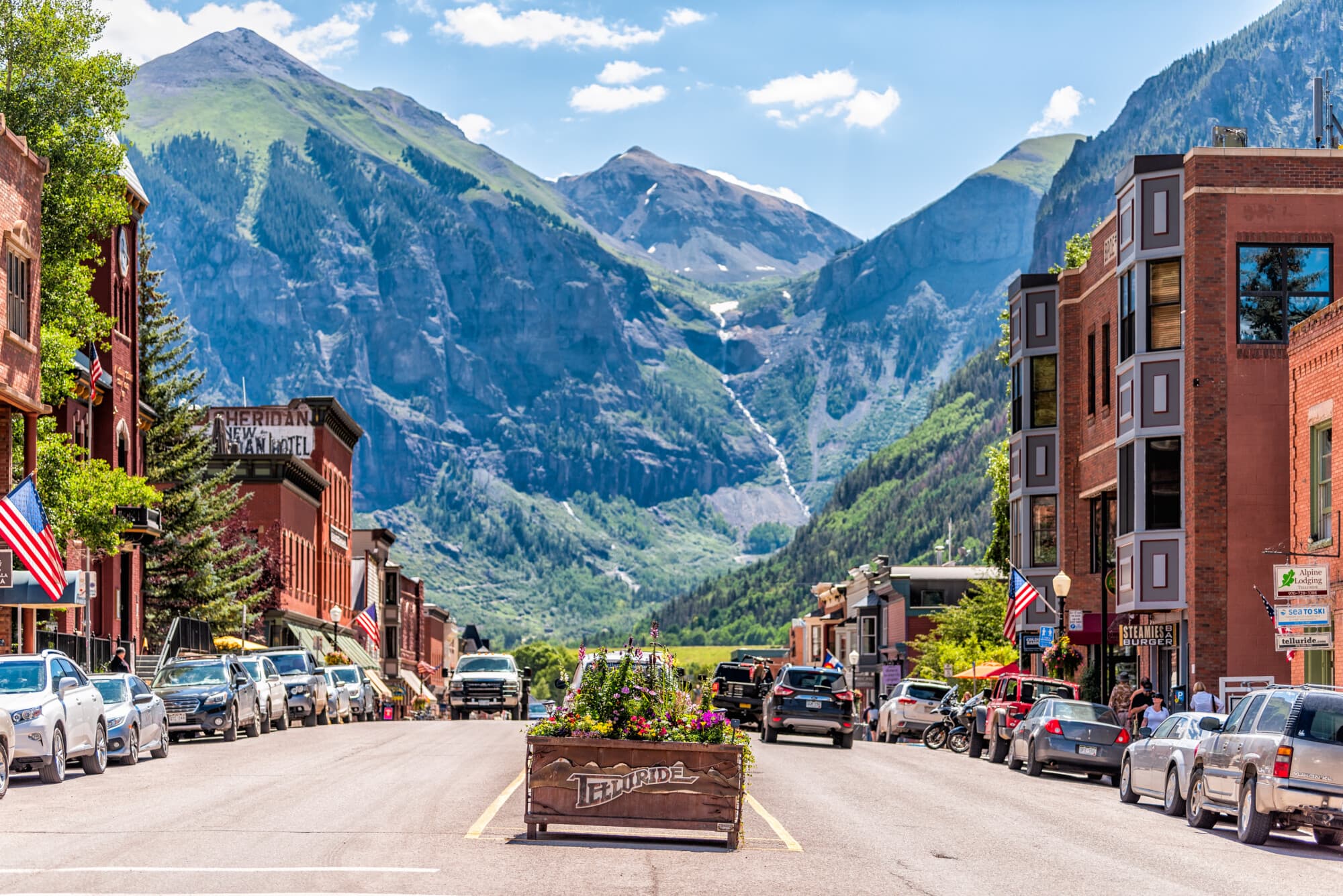 Downtown Telluride Colorado with mountain backdrop and Victorian architecture
